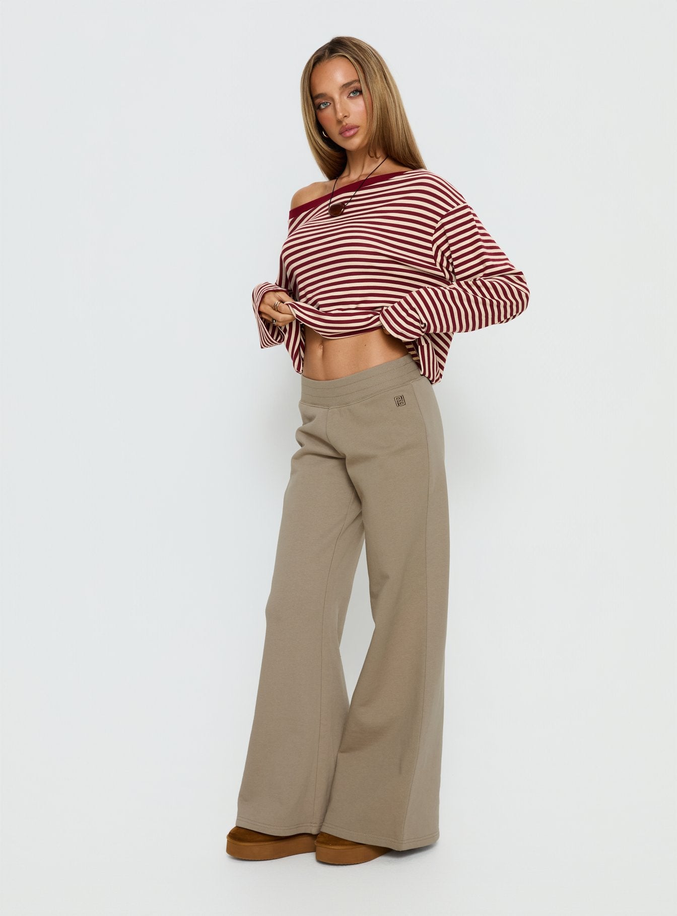 front view of model wearing Princess Polly Summits Flared Track Pants Latte Mid Rise Pants 