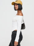 side view of model wearing Princess Polly Victorea Long Sleeve Top White Full Sleeves straight 