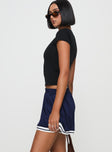 side view of model wearing Princess Polly Longer Days Short Navy High Waisted Shorts 