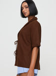 side view of model wearing Princess Polly Since New York Top Brown Half Sleeves Plunger 