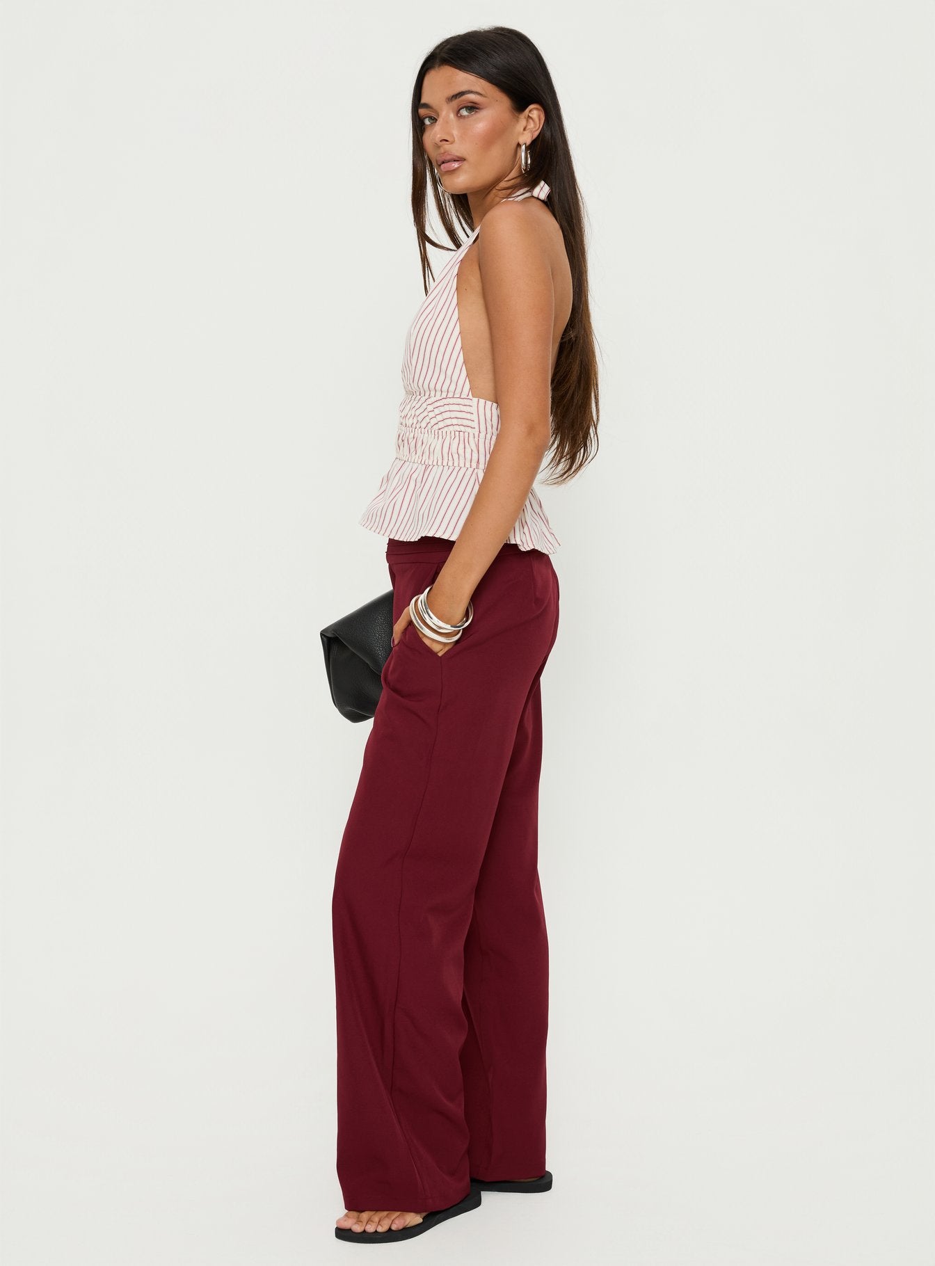 side view of model wearing Princess Polly Good Riddance Pleat Tie Slouch Pants Burgundy Mid Rise Pants 