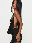 side view of model wearing Princess Polly Quotation Diamante Halter Backless Top Black Sleeveless Plunger 