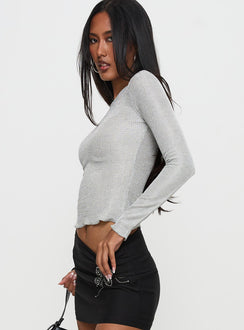 side view of model wearing Princess Polly Context Long Sleeve Top Silver Full Sleeves Crew Neck 