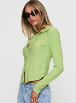 side view of model wearing Princess Polly Echoes Long Sleeve Top Green Full Sleeves V-Neck 