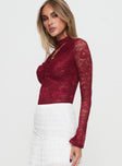 side view of model wearing Princess Polly Twisted Humour Long Sleeve Lace Bodysuit Burgundy Full Sleeves 