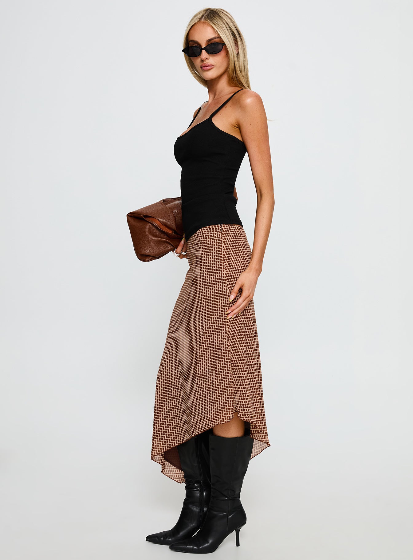   side view of model wearing Princess Polly Suella Asymmetrical Midi Skirt Brown Polka Dot Midi Skirts 