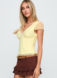 side view of model wearing Princess Polly The Icon Top Lemon Short Sleeves Plunger 