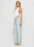 side view of model wearing Princess Polly Brayden Low Rise Relaxed Jeans Light Acid Wash Low Rise Jeans 