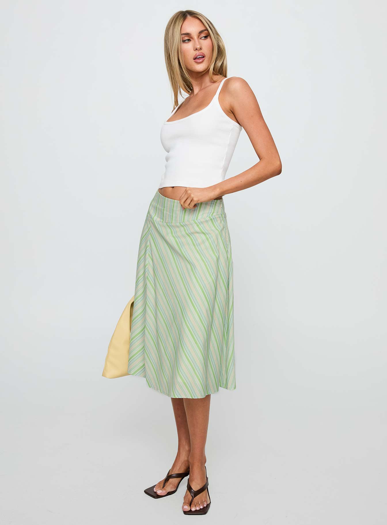   side view of model wearing Princess Polly Vettie Midi Skirt Green Multi Midi Skirts 
