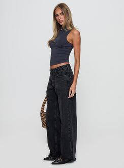 side view of model wearing Princess Polly Serenitia Mid Rise Relaxed Jeans Washed Black Tall Mid Rise 