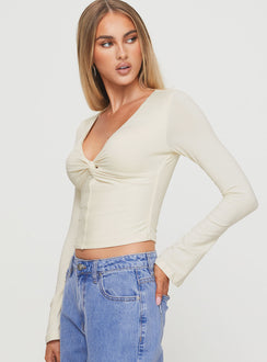 side view of model wearing Princess Polly Ophelie Top Cream Full Sleeves V-Neck 