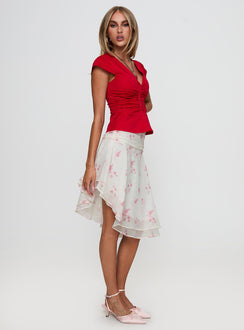   side view of model wearing Princess Polly Charisse Asymmetrical Midi Skirt Floral 