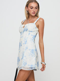 side view of model wearing Princess Polly Farrugia Mini Dress Cream Floral Square Neck 