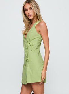 side view of model wearing Princess Polly Kodee Mini Dress Sage V-Neck 