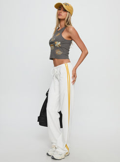 side view of model wearing Princess Polly Elation Low Rise Straight Leg Track Pant White Low Rise Pants 