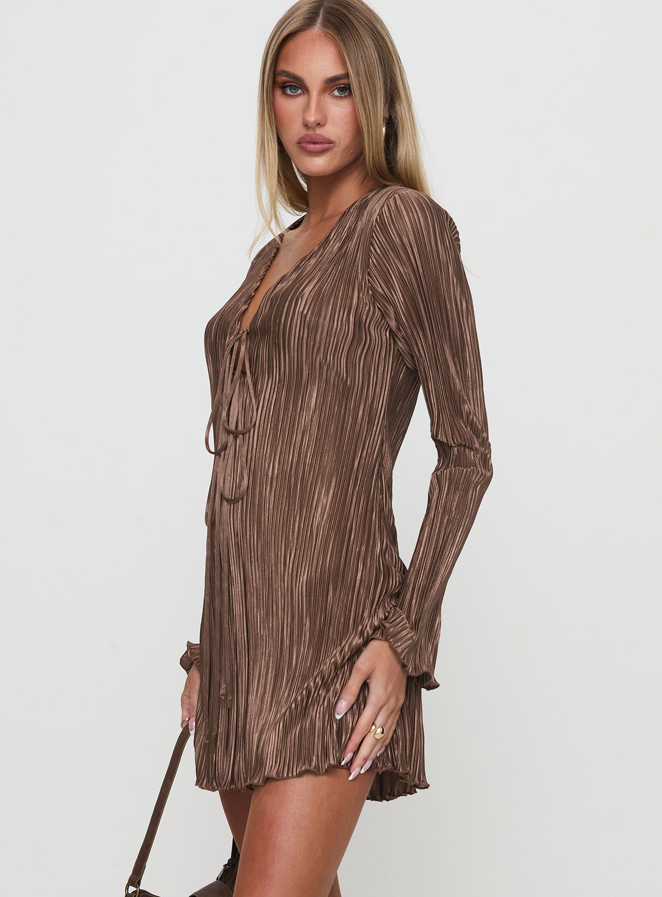 side view of model wearing Princess Polly Malop Long Sleeve Mini Dress Chocolate Petite V-Neck 