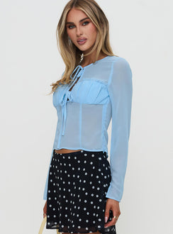 side view of model wearing Princess Polly Coates Long Sleeve Top Blue Full Sleeves Crew Neck 