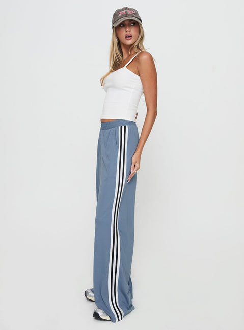 side view of model wearing Princess Polly Dime Track Pants Blue High Waisted Pants 