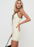 side view of model wearing Princess Polly Nolane Mini Dress Cream Tall V-Neck 