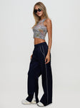 side view of model wearing Princess Polly Travalta Satin Track Pant Navy Low Rise Pants 