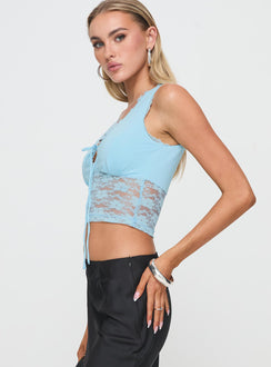 side view of model wearing Princess Polly Isolde Top Blue Sleeveless V-Neck 