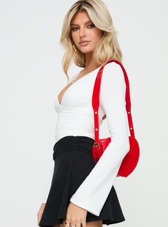 side view of model wearing Princess Polly Xander Long Sleeve Bodysuit White Long Sleeve Tops 