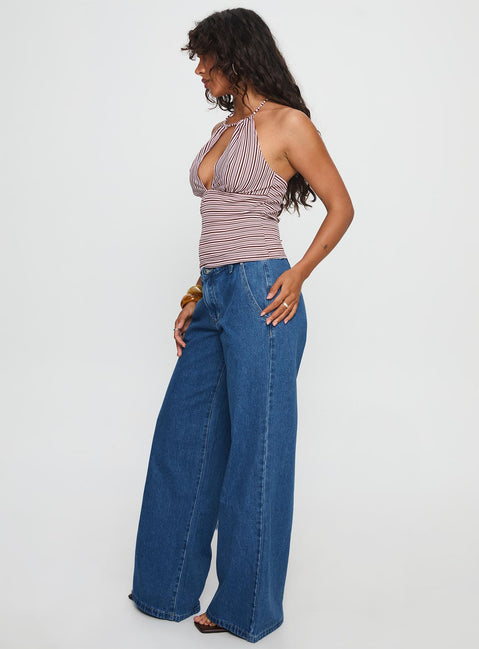side view of model wearing Princess Polly Polaris Mid Rise Straight Leg Jeans Mid Blue Mid Rise Jeans 