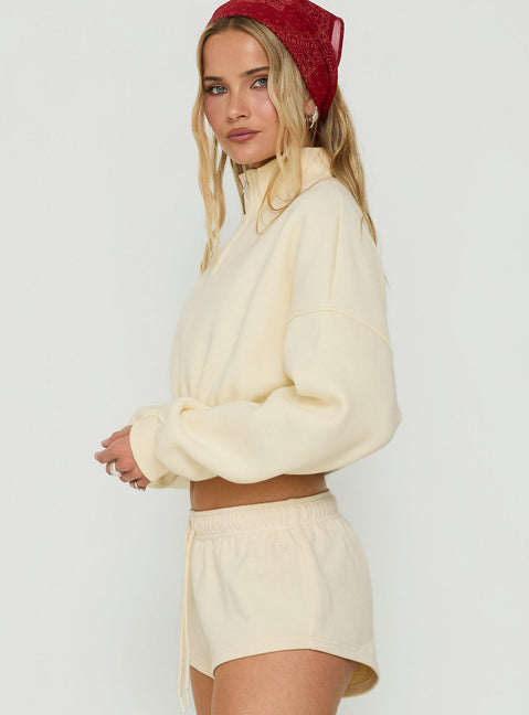 Crafted from the Astridd 3/4 Zip Cropped Jumper in Cream womens-jumpers with short length side view of model wearing Princess Polly