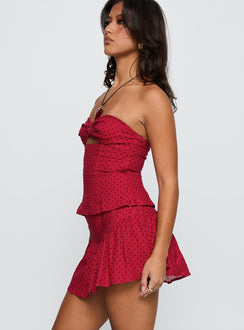 side view of model wearing Princess Polly Tovie Frill Linen Blend Skort Red Polka Low Rise Shorts 