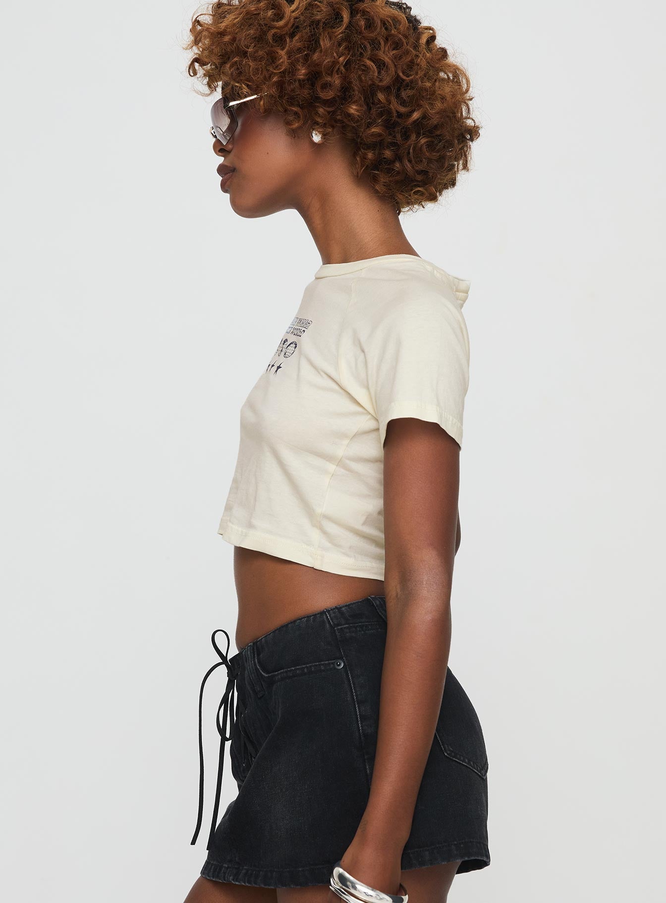 side view of model wearing Princess Polly Outta This World Tee Cream Short Sleeves Crew Neck 