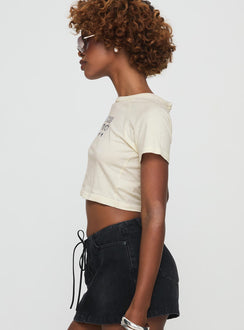 side view of model wearing Princess Polly Outta This World Tee Cream Short Sleeves Crew Neck 