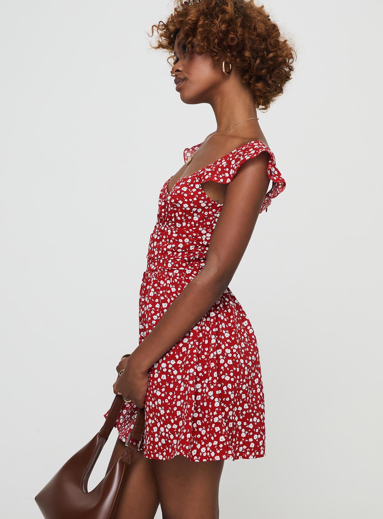 side view of model wearing Princess Polly So Sweet Mini Dress  Red / Floral Sweetheart Neckline 