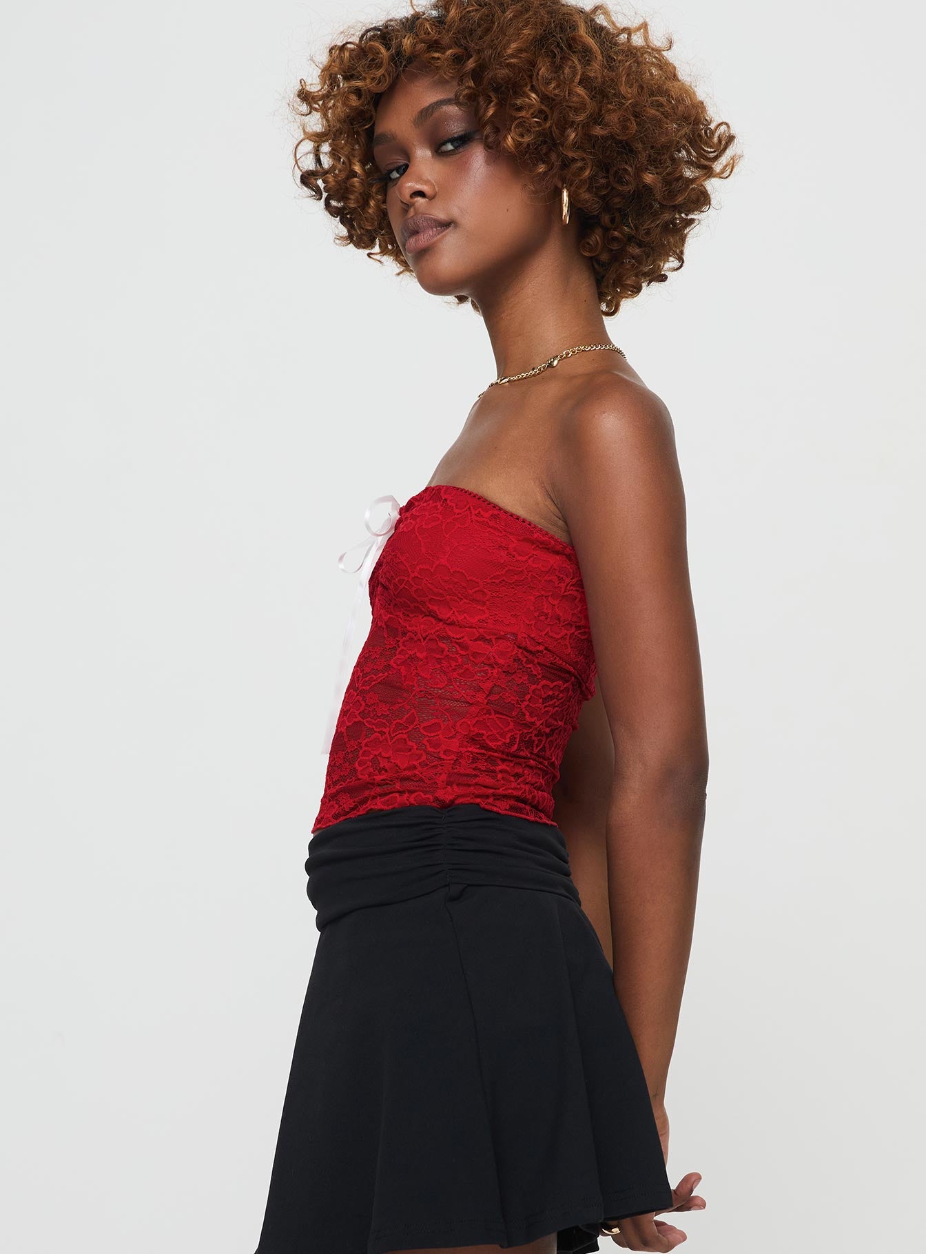 side view of model wearing Princess Polly Winnick Strapless Lace Top Red Sleeveless Sweetheart 