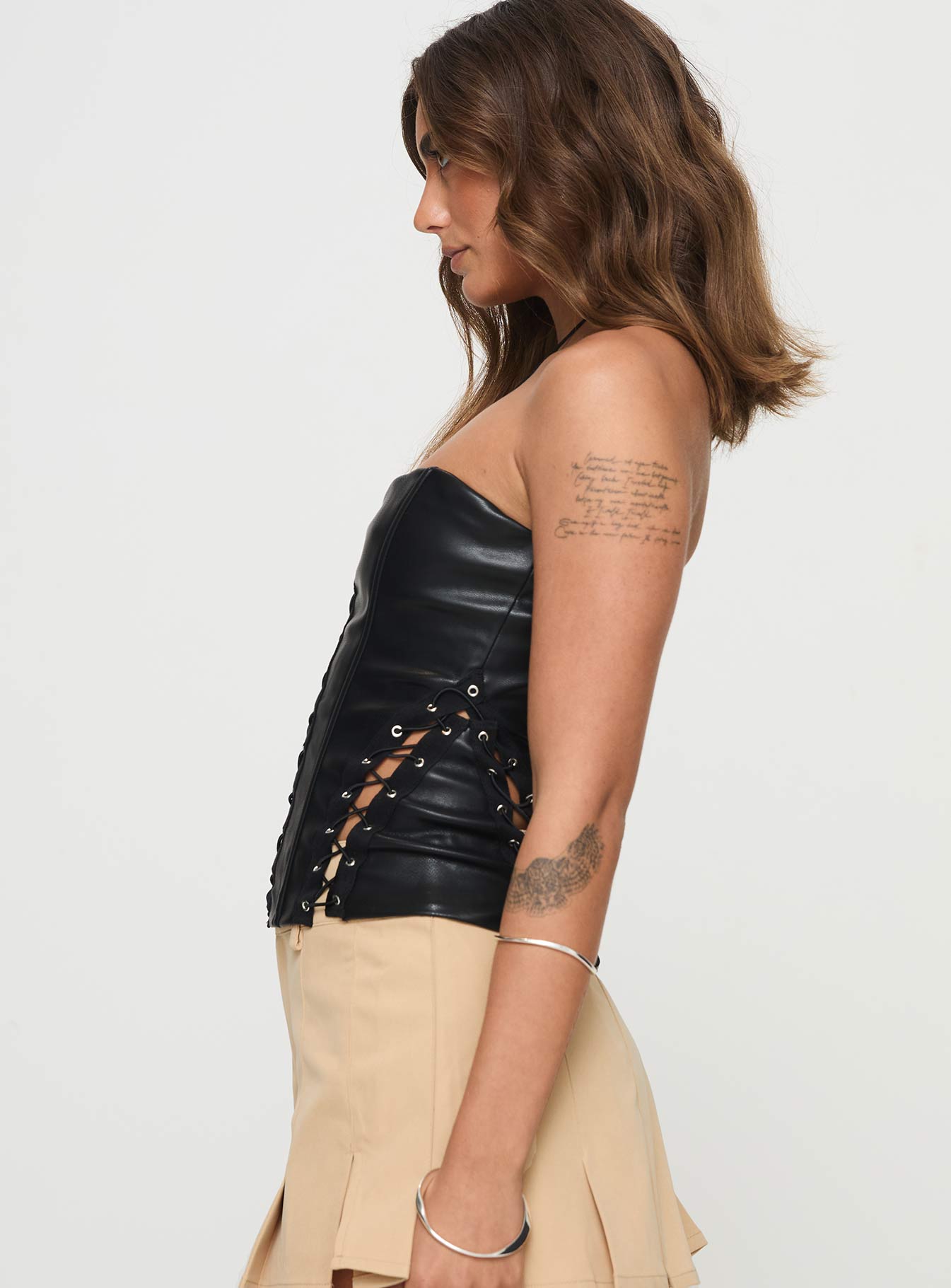 side view of model wearing Princess Polly Emberlyn Faux Leather Corset Top Black Sleeveless straight 