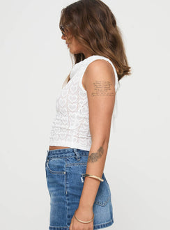 side view of model wearing Princess Polly Caron Top Baby White Sleeveless Cowl 