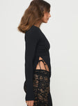 side view of model wearing Princess Polly Varian Long Sleeve Top Black Full Sleeves Crew Neck 