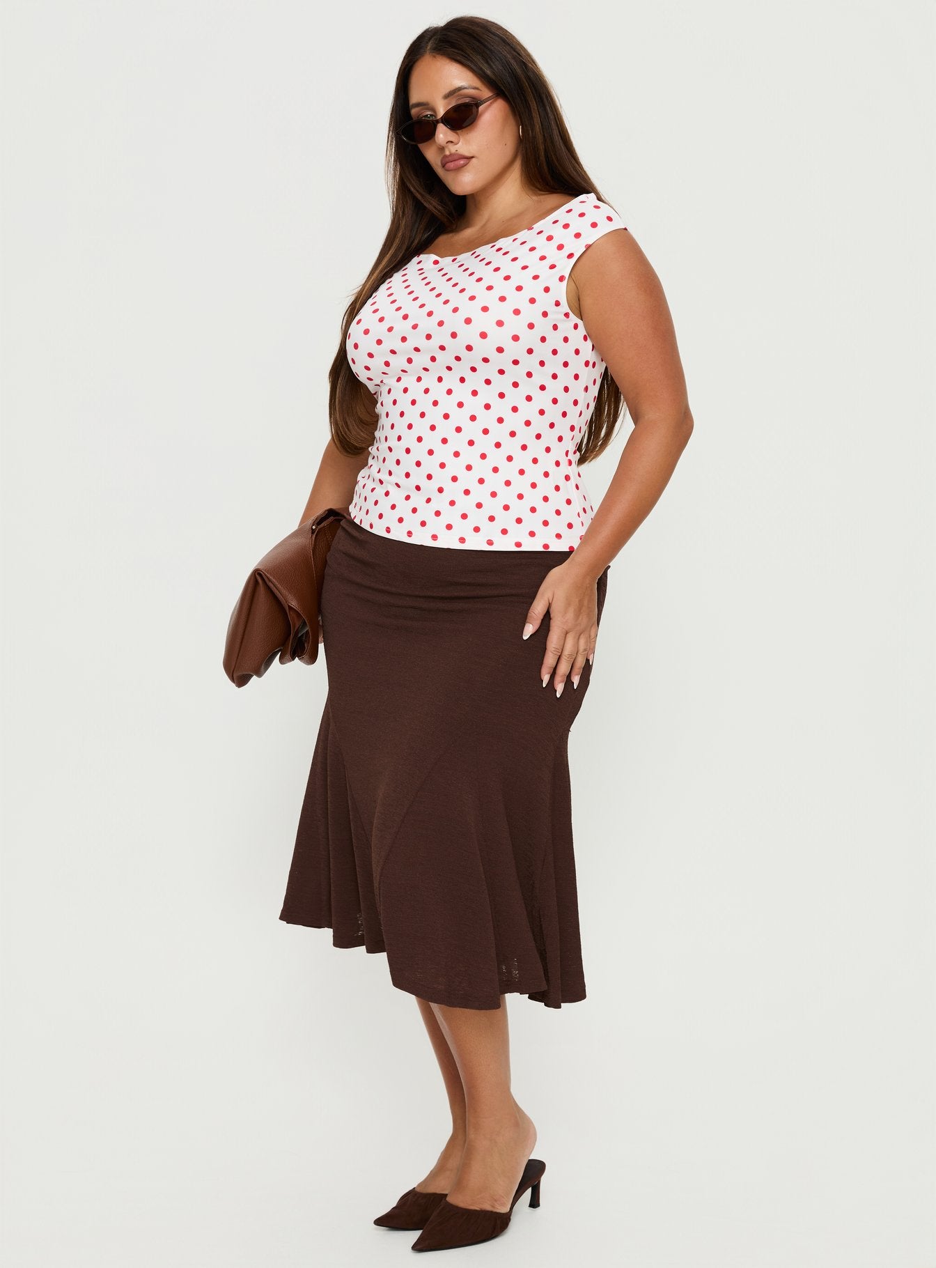   side view of model wearing Princess Polly Lewish Low Rise Midi Skirt Chocolate Curve Midi Skirts 