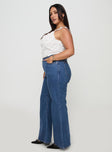 side view of model wearing Princess Polly Lucille High Rise Flare Leg Jeans Mid Wash Curve High Waisted 