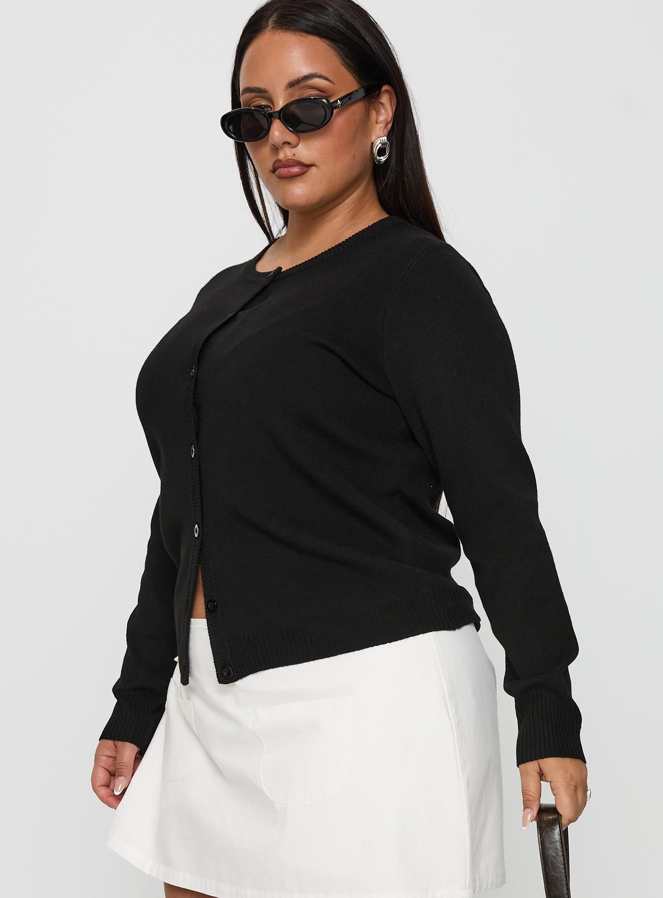 side view of model wearing Princess Polly Lauraine Cardigan Black Curve 