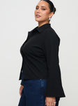 side view of model wearing Princess Polly Anni Pinstripe Shirt Black Curve Full Sleeves High Neck 