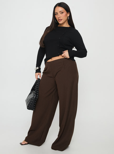 side view of model wearing Princess Polly Khane Low Rise Wide Leg Pant Brown Pinstripe Curve Low Rise Pants 
