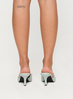 Slide on pump design, closed pointed toe, kitten heel, scalloped topline detail, metal eyelet detail, bow on upper Denim textile upper, non-leather outsole & heel