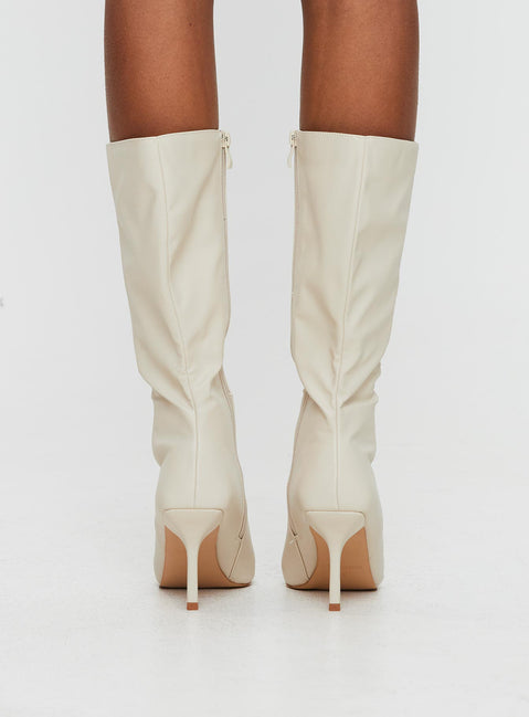 Cream Knee-high boots Faux leather material, zip fastening at inside, pointed toe, stiletto heel