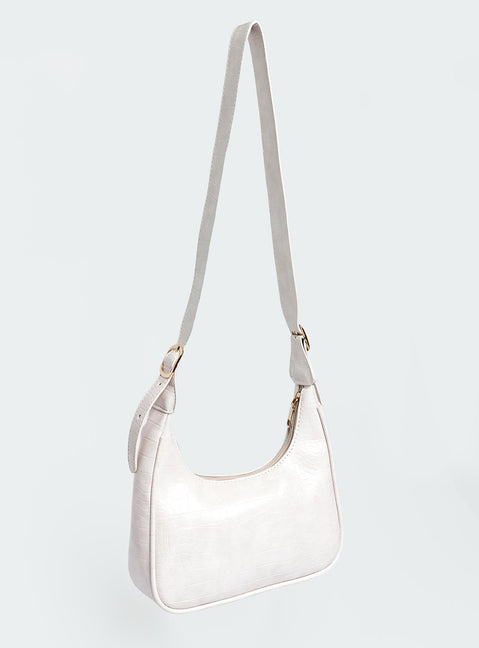 Shoulder bag Adjustable shoulder strap  Gold-toned hardware   Zip fastening  Single internal zip pocket  Flat base 