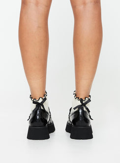 Faux leather loafers Silver-toned hardware Rounded toe, treaded sole, padded footbed, buckle detail, slip-on design