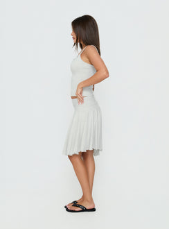 Crafted from the Mimmi Asymmetrical Midi Skirt Grey womens-skirts with ruched fitted design and frayed hem side view of model wearing Princess Polly
