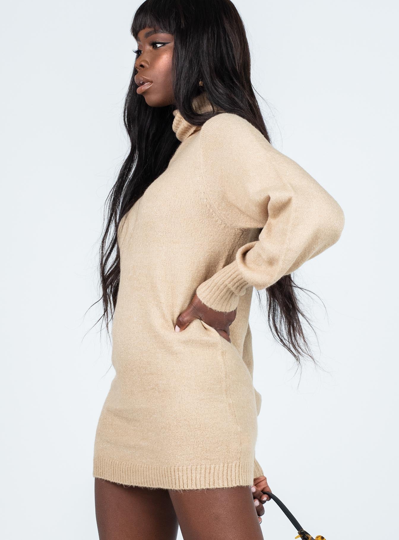 side view of model wearing Princess Polly Zahara Mini Dress Beige Petite High Neck 