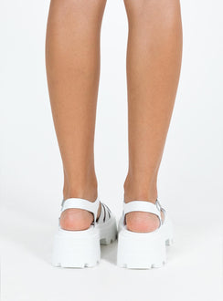 Sandals Faux leather material Platform base Strappy upper Buckle fastening Silver-toned hardware Treaded sole Padded footbed