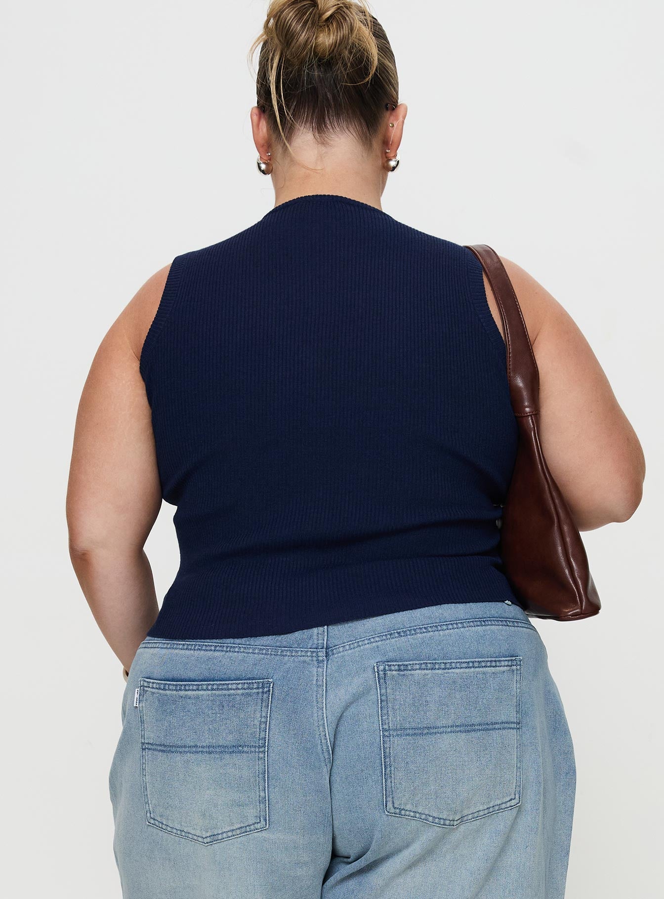 back view of model wearing Princess Polly Suzu Sleeveless Top Navy Curve Sleeveless Crew Neck 