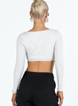 Long sleeve crop top V neckline Pinched detail at bust Good stretch Lined body